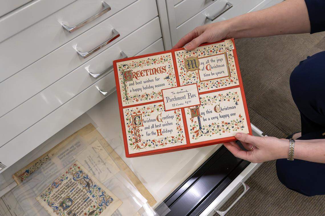Archivist Samantha Bradbeer showcases Hallmark artifacts that staff use for reference and inspiration at the Hallmark headquarters on Tuesday, Aug. 5, 2025, in Kansas City.