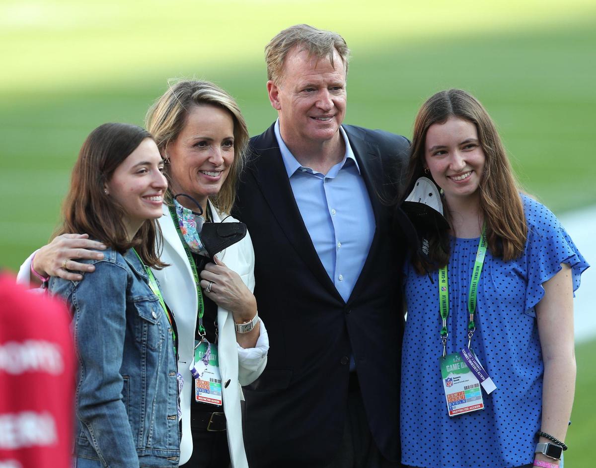 Roger Goodell, second from right, commissioner of the NFL, poses with football fans Sunday, February 7, 2021, before the start of Super Bowl LV at Raymond James Stadium in Tampa, Florida.