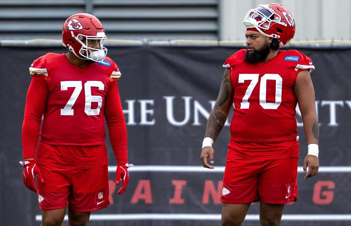 Chiefs tackle Kingsley Suamataia (No. 76) and fellow offensive lineman Esa Pole chat during practice at the training facility on Saturday, October 25, 2025, in Kansas City. It was the first practice for Pole as a member of the Chiefs.