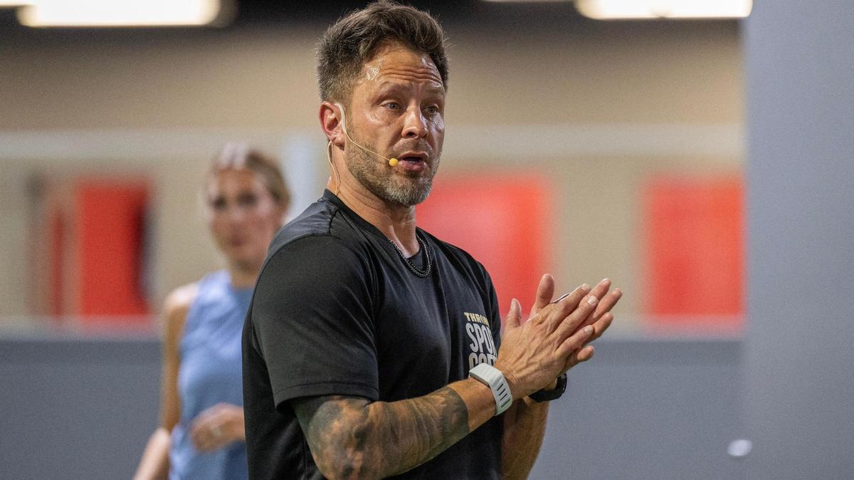 Bobby Stroupe, personal strength and conditioning coach for Patrick Mahomes, leads participants through a mobility exercise during a training session at Homefield Kansas City on Friday, Oct. 18, 2024, in Olathe.