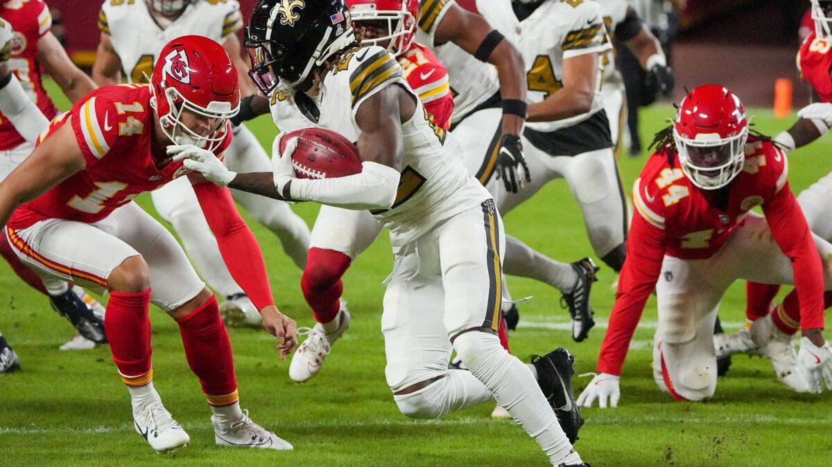 Oct 7, 2024; Kansas City, Missouri, USA; New Orleans Saints running back Alvin Kamara (41) returns a kick as Kansas City Chiefs punter Matt Araiza (14) defends during the first half at GEHA Field at Arrowhead Stadium. Mandatory Credit: Denny Medley-Imagn Images
