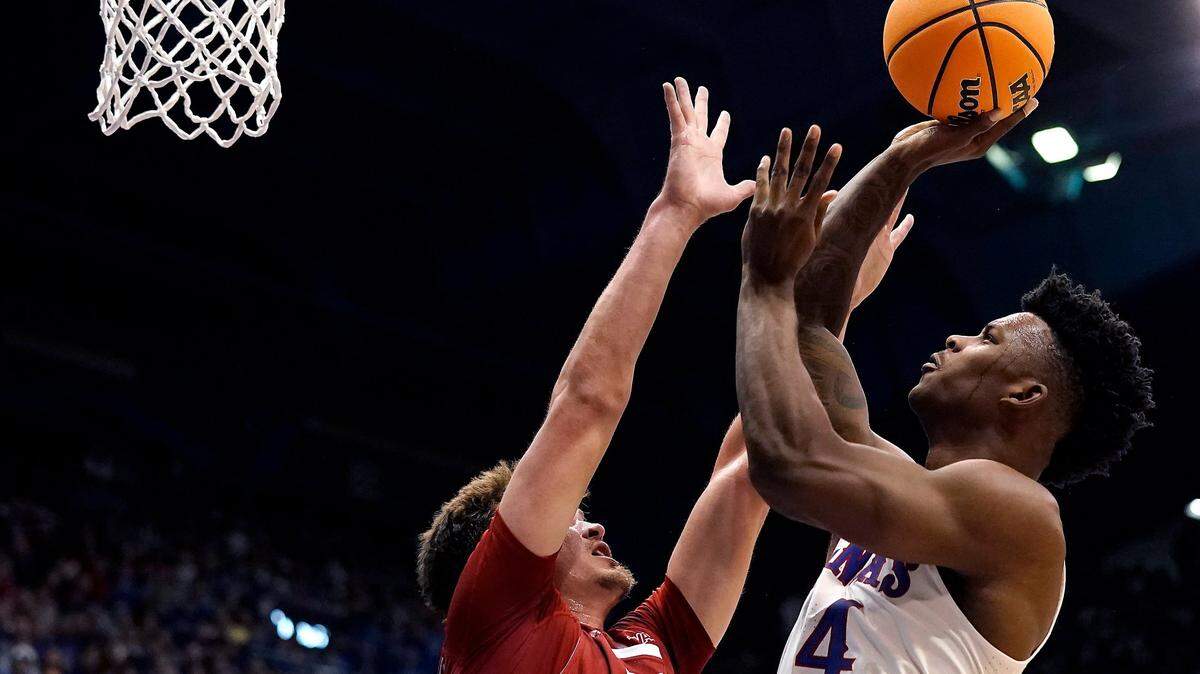 Kansas forward K.J. Adams shoots over Southern Utah forward Maizen Fausett during a college basketball game Friday, Nov. 18, 2022, in Lawrence, Kan.
