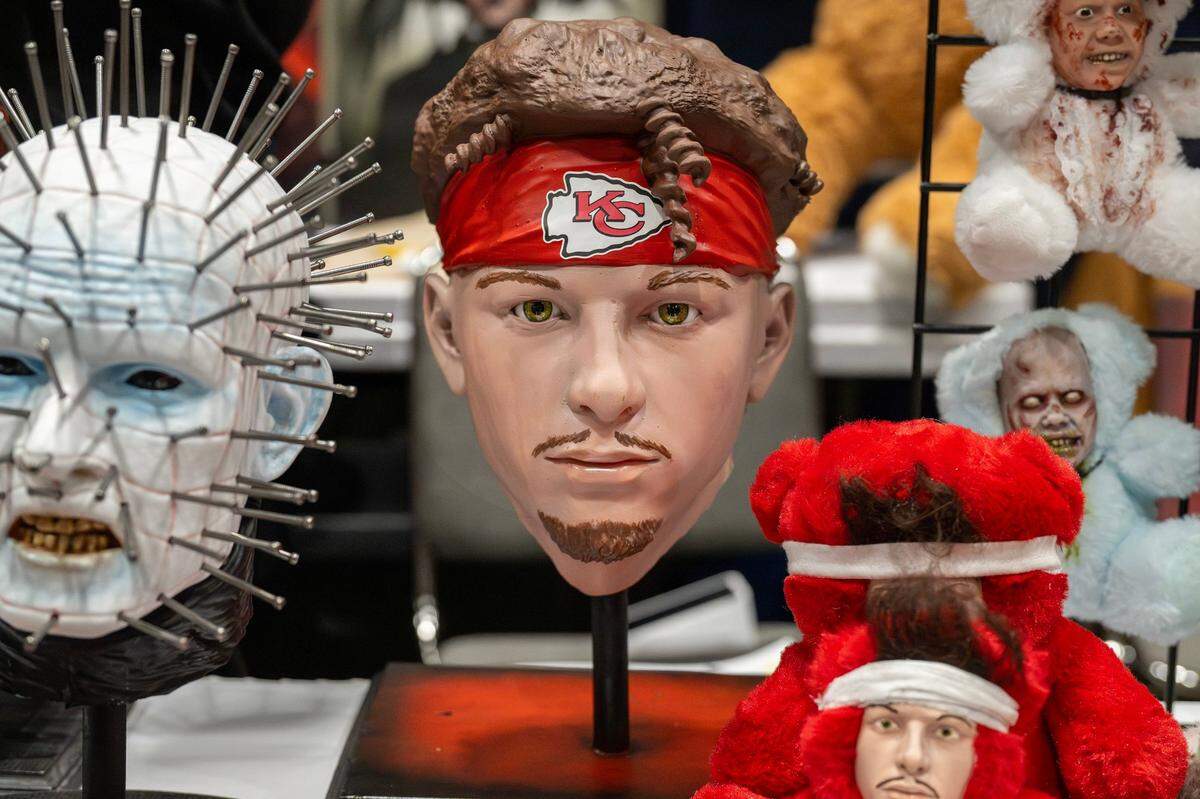 A head bust of Kansas City Chiefs quarterback Patrick Mahomes is displayed alongside other busts at the Patrick Hart booth during Planet Comicon at the Kansas City Convention Center on Friday, March 21, 2025.