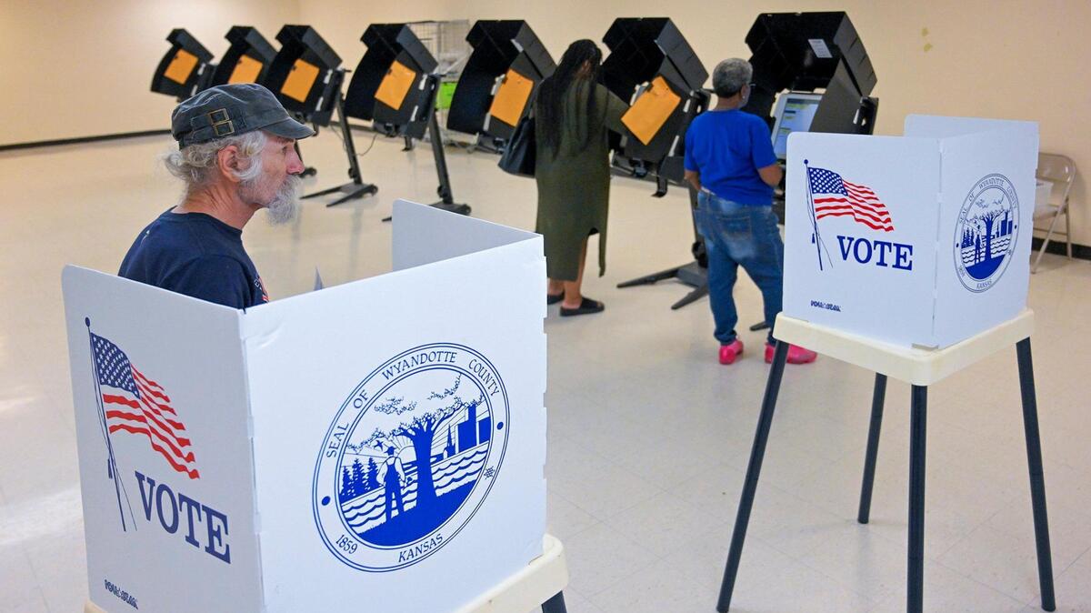 Tim Slagle of Kansas City, Kansas, paused after he filled out his paper ballot as other voters used electronic voting machines to cast their ballots in the general election on Tuesday, Nov. 7, 2023, at the Bethany Community Center in Kansas City, Kansas.