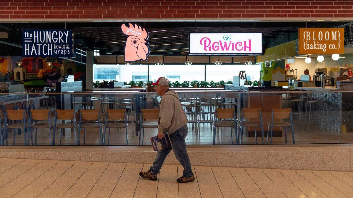 A man walks by a food court in Concourse A at the Kansas City International Airport terminal on Feb. 18 in a preview before opening day.