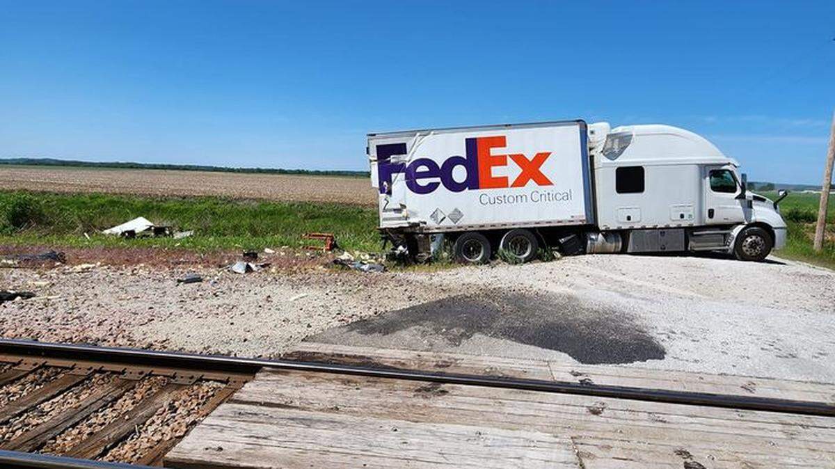Authorities say a train crashed into a FedEx truck in Platte County Saturday morning.