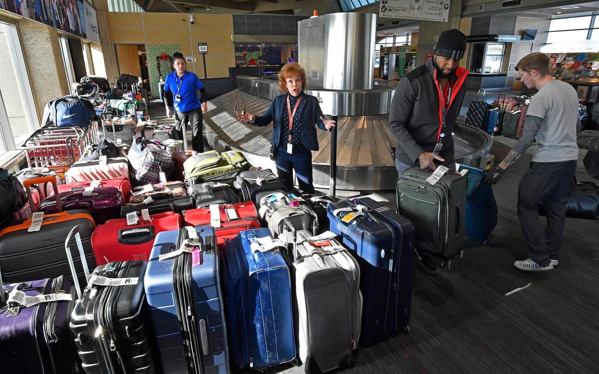It was an all hands on deck afternoon for Jill Bridges, middle, and her crew from Southwest Airlines, who were alphabetically sorting the sea of baggage Tuesday inside B terminal at Kansas City International Airport. “I’ve never had an airline experience like this, and I’ve been working here since 1980,” Bridges said. The customer service manager called on all of her team to help arrange all the bags that made it to Kansas City minus the owners. Dozens of cancellations plagued the airline as a major winter storm rolled across the nation during the Christmas holiday.