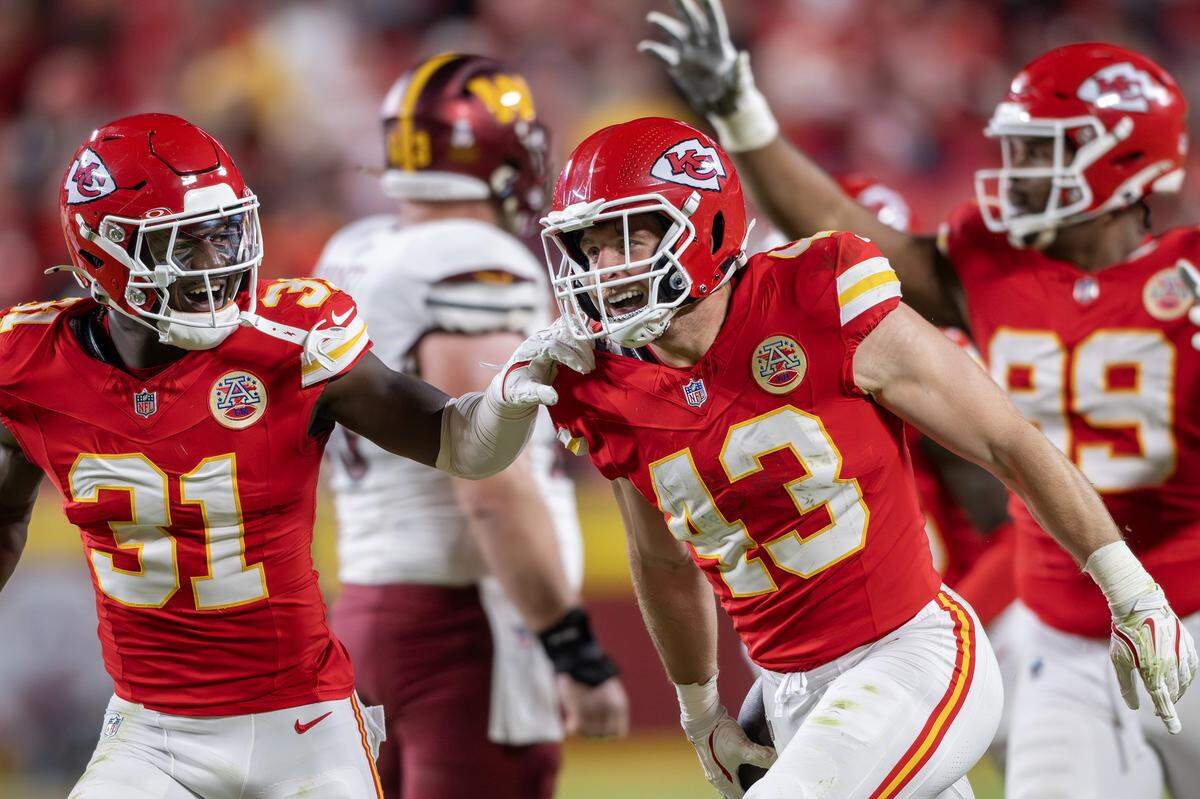 Kansas City Chiefs safety Nazeeh Johnson (13) celebrates with linebacker Jeffrey Bassa (31) after intercepting a pass in the fourth quarter against the Washington Commanders on Monday, Oct. 27, 2025, at GEHA Field at Arrowhead Stadium.