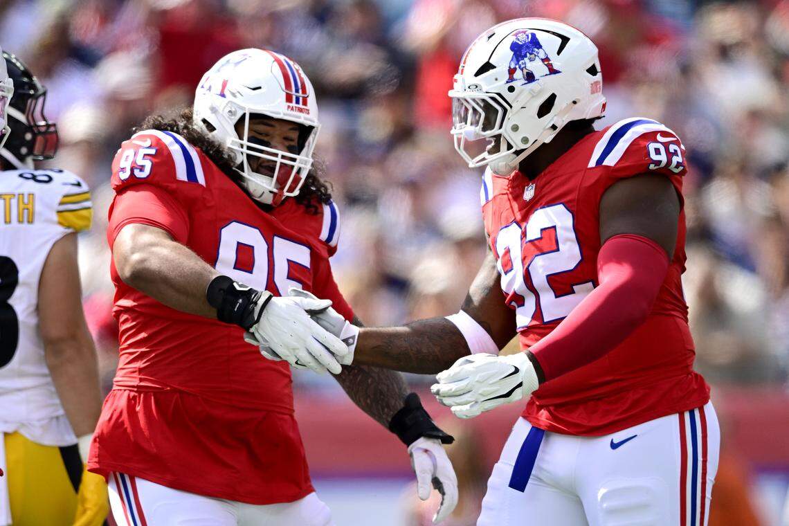 FOXBOROUGH, MASSACHUSETTS - SEPTEMBER 21: Khyiris Tonga #95 celebrates with Joshua Farmer #92 of the New England Patriots during the first half against the Pittsburgh Steelers at Gillette Stadium on September 21, 2025 in Foxborough, Massachusetts. (Photo by Jaiden Tripi/Getty Images)