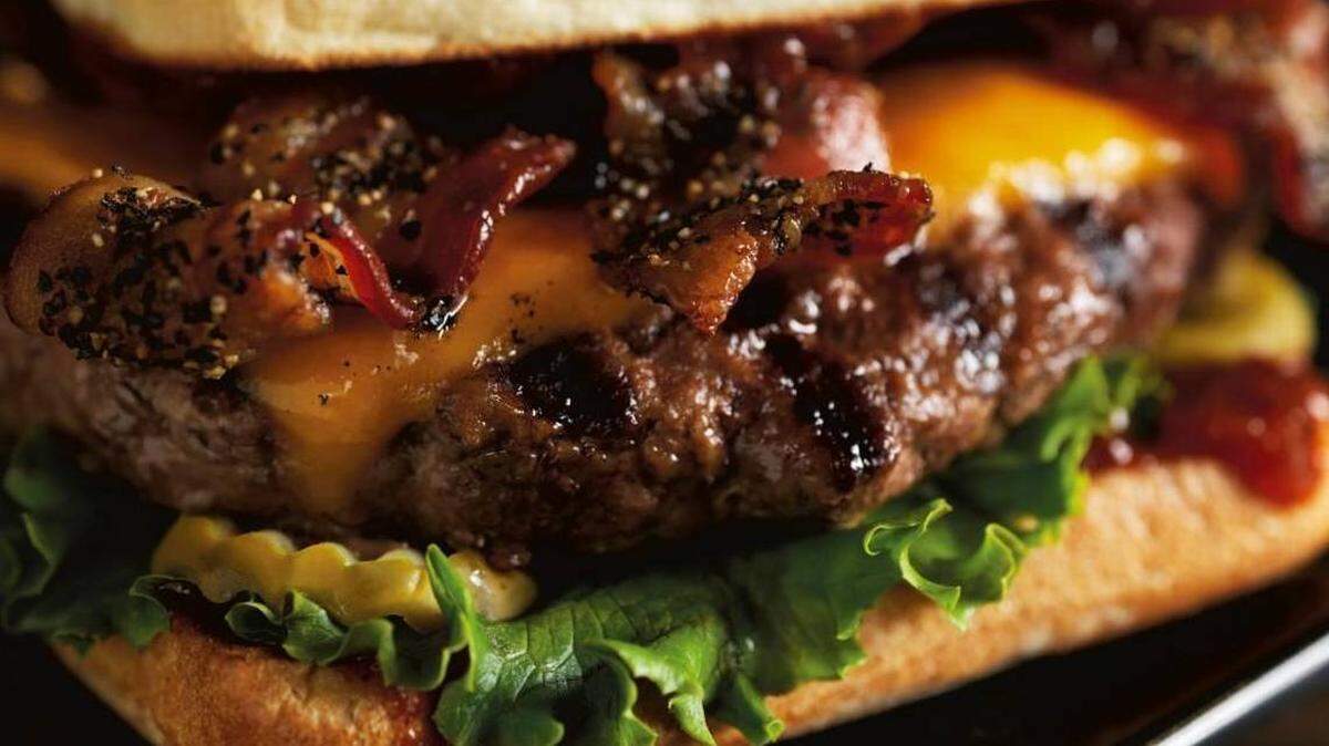 Red Robin’s Smoke & Pepper burger is a half pound of Black Angus topped with black-pepper bacon and extra-sharp cheddar on a toasted ciabatta bun with house-made Smoke & Pepper ketchup.