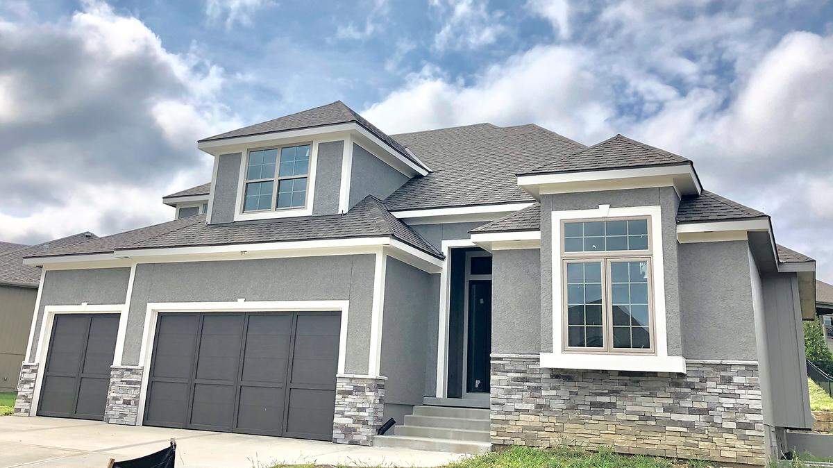 The Riviera 1½-story, built by Parkview Homes, features 2 two bedrooms on the main floor, soaring vaulted ceilings in the great room, a floor-to-ceiling fireplace, a covered patio and and enameled white kitchen. Priced at $479,900, the home is located at 13017 W. 170th St., is ready for a buyer’s finish selections and is open today until 5 p.m.
