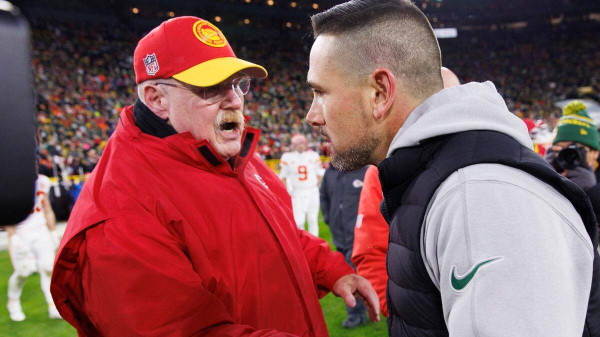 Chiefs coach Andy Reid, left, congratulates Green Bay Packers coach Matt LaFleur after Sunday night’s game at Lambeau Field.