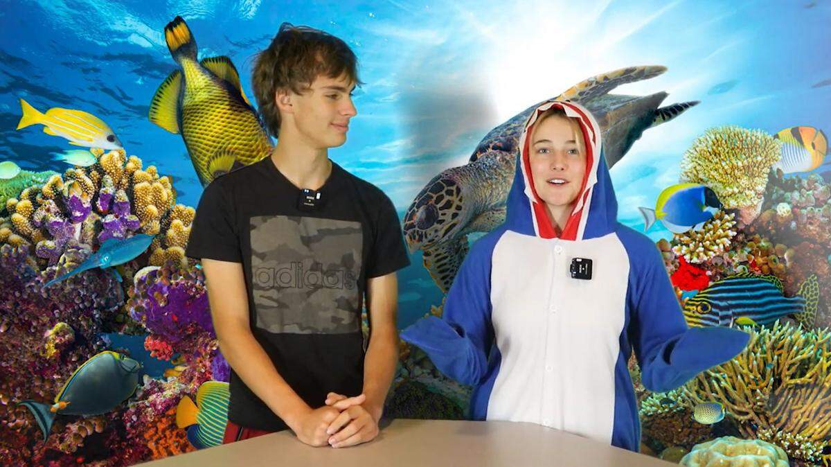 Olathe East students Zack Humrichouse and Adelyn Garst appear in the promotional video the team created to go along with their Battle of the Brains entry.