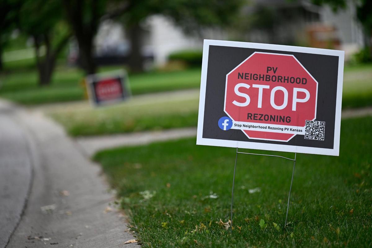 “Stop Rezoning” signs have been cropping up in yards across Prairie Village, as neighbors protest the city’s idea to amend zoning laws to allow for more duplexes, apartment buildings and townhomes. 