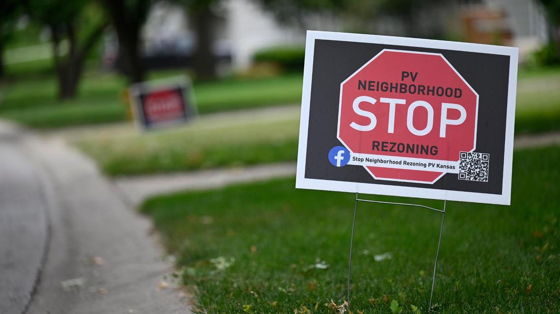 “Stop Rezoning” signs have been cropping up in yards across Prairie Village, as neighbors protest the city’s idea to amend zoning laws to allow for more duplexes, apartment buildings and townhomes. 