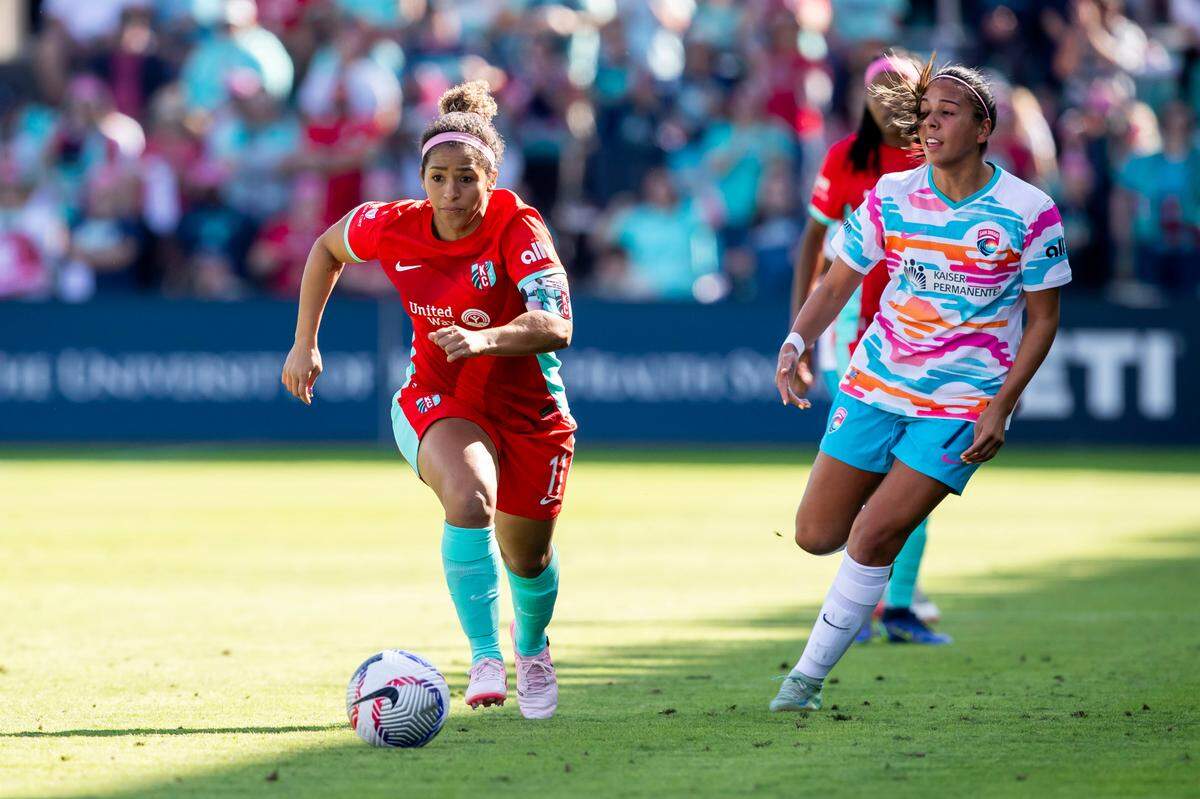 Kansas City Current midfielder Desiree Scott, left, goes after the ball during Saturday’s match against the San Diego Wave FC at CPKC Stadium.