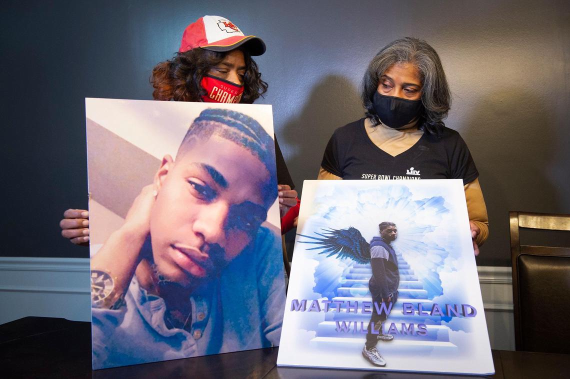 Pamela Bland, left, mother of Matthew Bland-Williams, and her sister, Arletha Bland-Manlove, look over photos of Matthew Bland-Williams, who was just 26 years old when he was fatally shot July 23, 2020, outside a home in Independence.