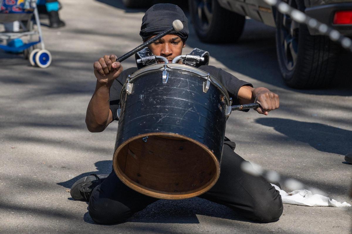 A member of the KC Fusion Drill Team performs during the Krewe de Prank parade on Sunday, March 2, 2025, in Kansas City.