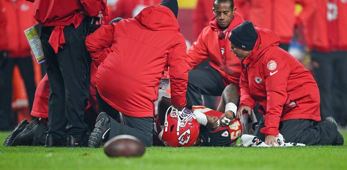 Kansas City Chiefs offensive tackle Wanya Morris (64) suffers an injury in the first play of the game against the Houston Texans at GEHA Field at Arrowhead Stadium on Sunday, Dec. 7, 2025.