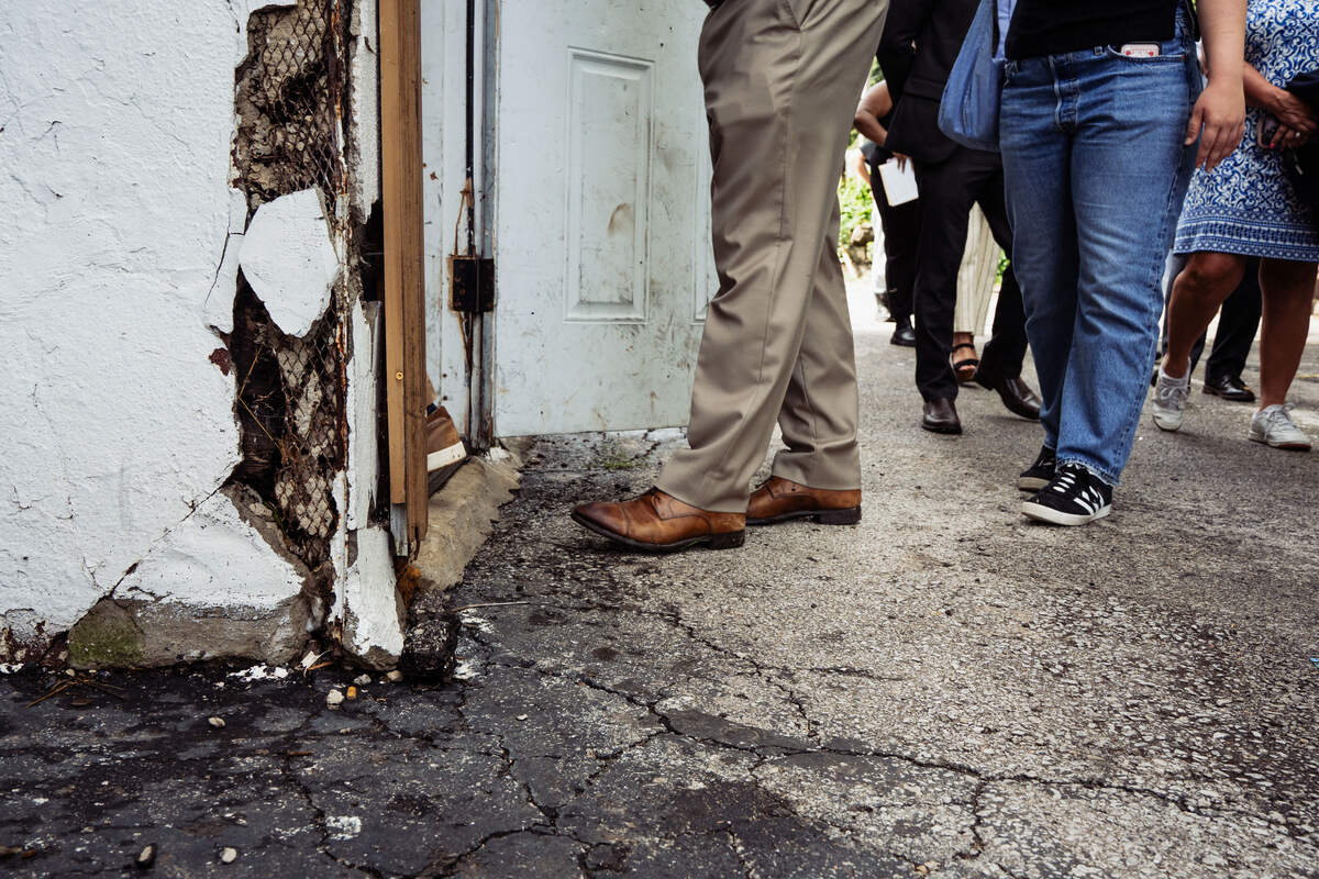A crumbling exterior is seen at an apartment complex on North Lawn Avenue. City officials recently met with tenants to discuss the living conditions of the facility and how to address them.