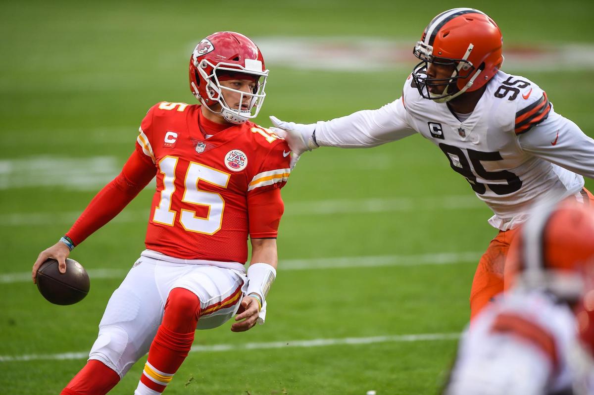 Kansas City Chiefs quarterback Patrick Mahomes is pressured by Cleveland Browns defensive end Myles Garrett in the first half Sunday, January 17, 2021, at Arrowhead Stadium in Kansas City, Missouri.