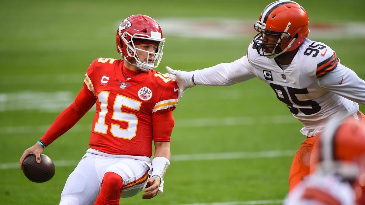 Kansas City Chiefs quarterback Patrick Mahomes is pressured by Cleveland Browns defensive end Myles Garrett in the first half Sunday, January 17, 2021, at Arrowhead Stadium in Kansas City, Missouri.