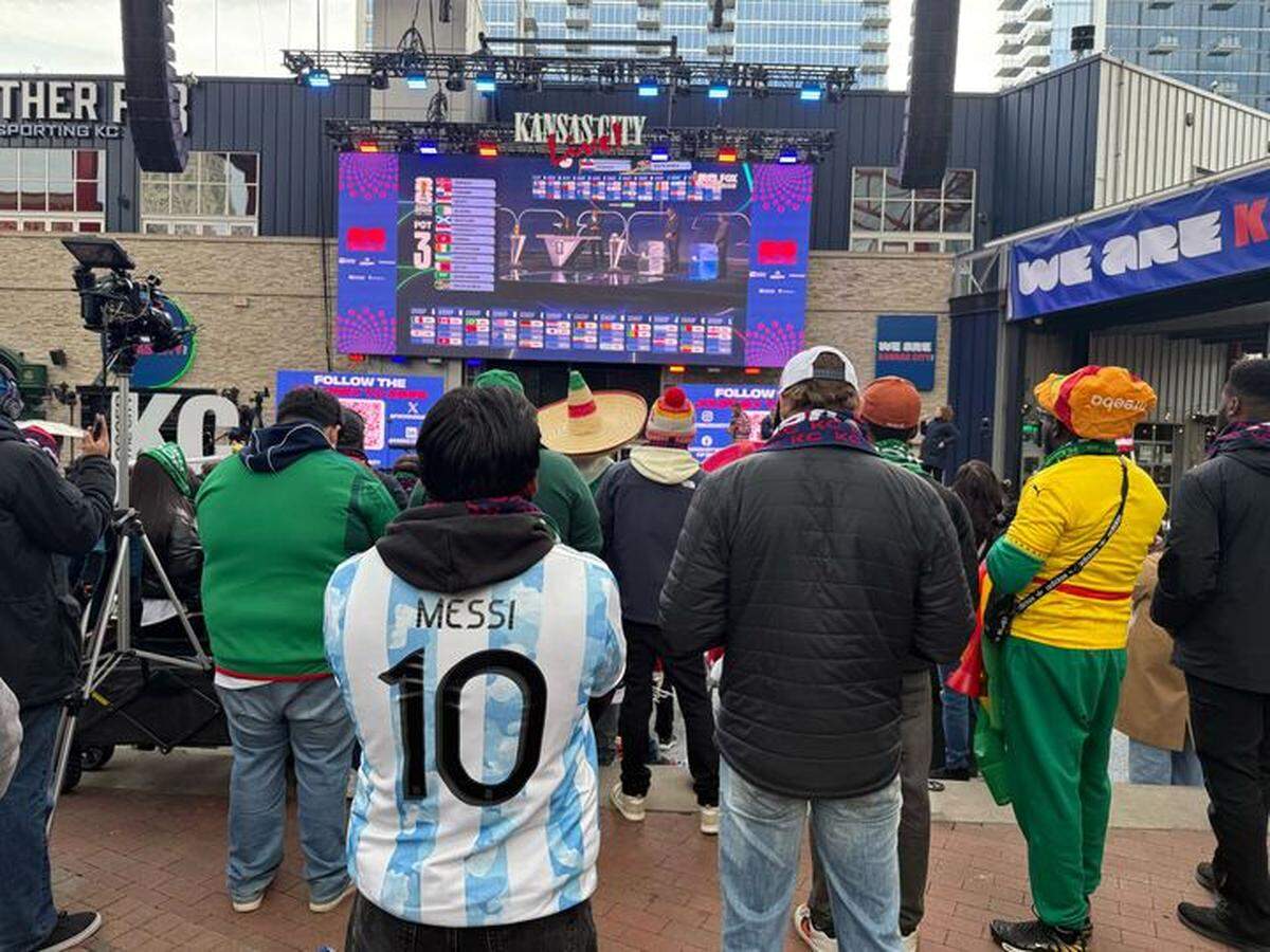 Jaime Bautista watches the World Cup draw at the Power & Light District on Friday, Dec. 5, in Kansas City.
