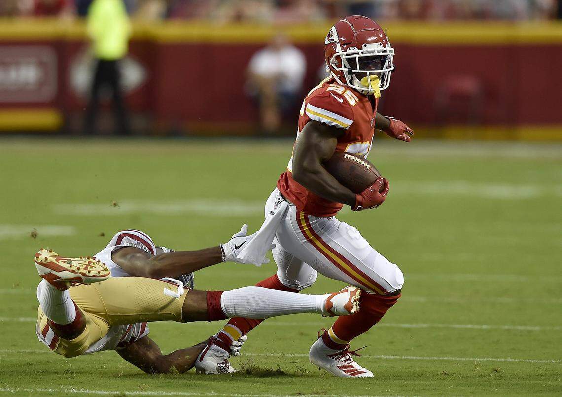 Kansas City Chiefs running back Darwin Thompson (25) gets away from San Francisco 49ers cornerback Ahkello Witherspoon (23) to gain yards in the second quarter of the Kansas City Chiefs preseason game against the San Francisco 49ers at Arrowhead Stadium Saturday, Aug. 24, 2019. The 49ers led 13-10 at the half.