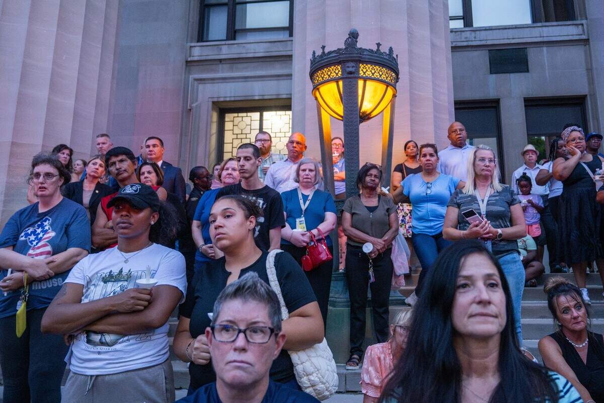 Hundreds of people attend the candlelight vigil after a sheriff’s deputy was fatally shot.