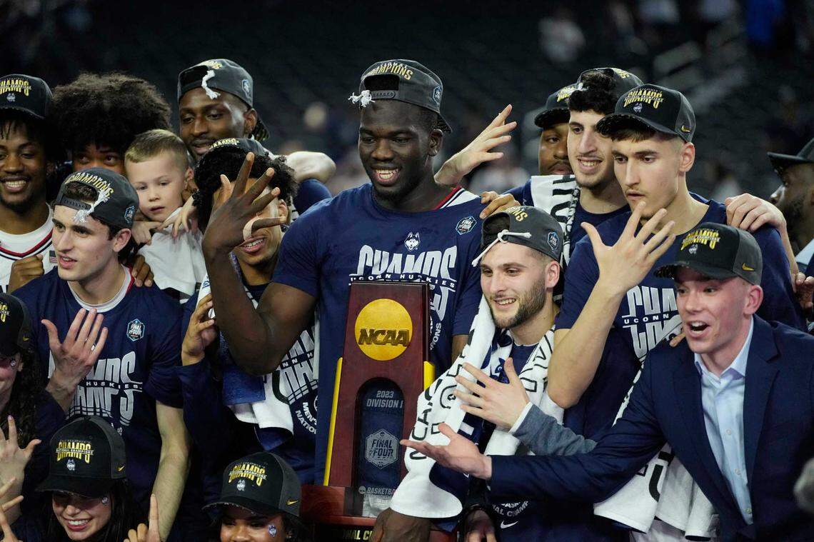 Connecticut Huskies players celebrate after defeating the San Diego State Aztecs in the national championship game of the 2023 NCAA Tournament. Stonehill College played UConn in the Skyhawks’ first game as an NCAA Division I school last season.