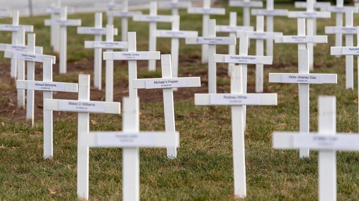 More than 170 crosses – individually marked with the names of a 2023 Kansas City homicide victim – dot the lawn outside of the Gathering Church on Wednesday, Dec. 20, 2023, in Independence, Missouri. A candlelight vigil and memorial service will be held at the church Thursday night to honor the year’s homicide victims.