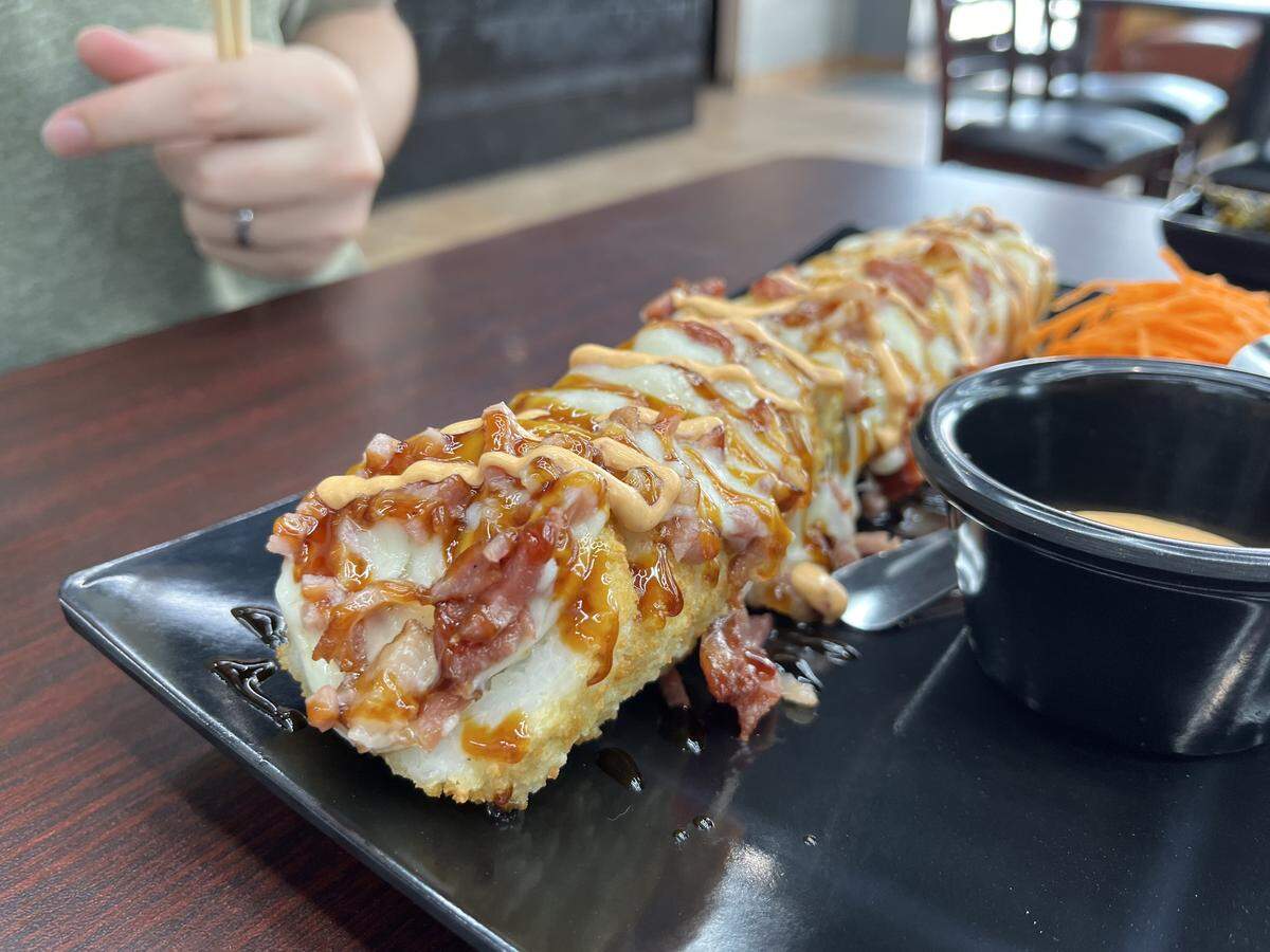 The Buchona Roll (chicken, crab, melted mozzarella, avocado, cream cheese and eel sauce) is a baked roll from KCulichi Sushi ($16).