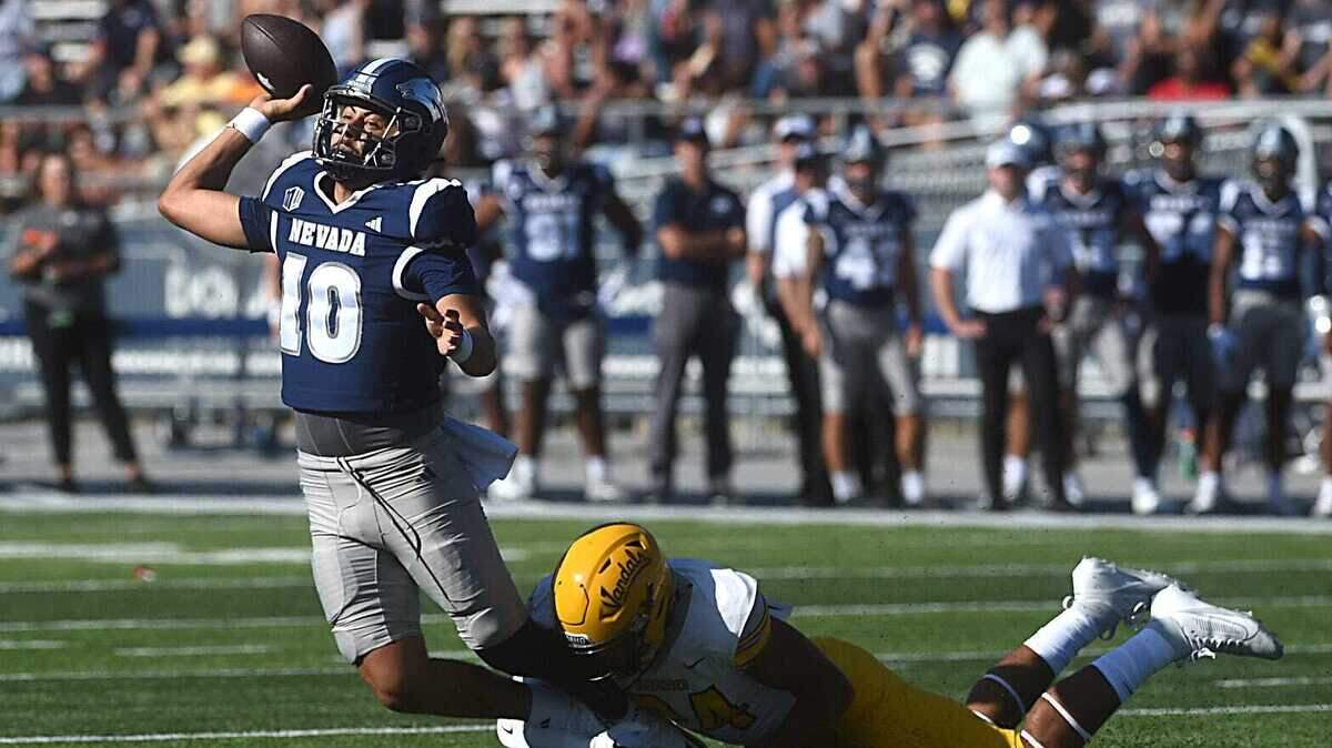 Nevada quarterback AJ Bianco tries to get rid of the ball during Saturday’s loss to Idaho at Mackay Stadium in Reno, Nevada.