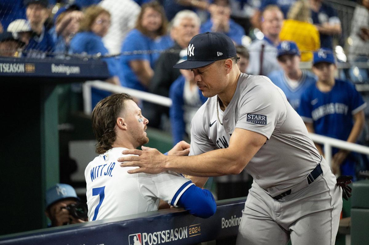 New York Yankees designated hitter Giancarlo Stanton (27) greets Kansas City Royals shortstop Bobby Witt Jr. (7) after the Yankees defeated the Royals 3-1 in Game 4 of the American League Division Series on Thursday, Oct. 10, 2024, at Kauffman Stadium.