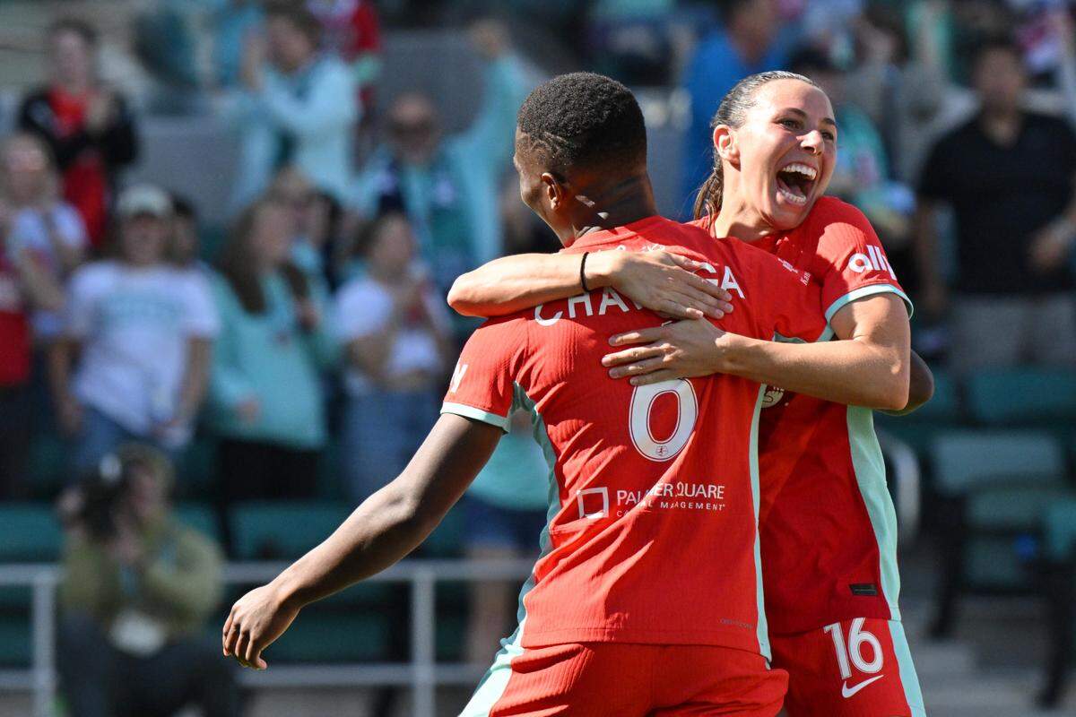 Kansas City Current forward Temwa Chawinga celebrates with teammate Vanessa DiBernardo after scoring during Saturday’s match against San Diego Wave FC at CPKC Stadium.