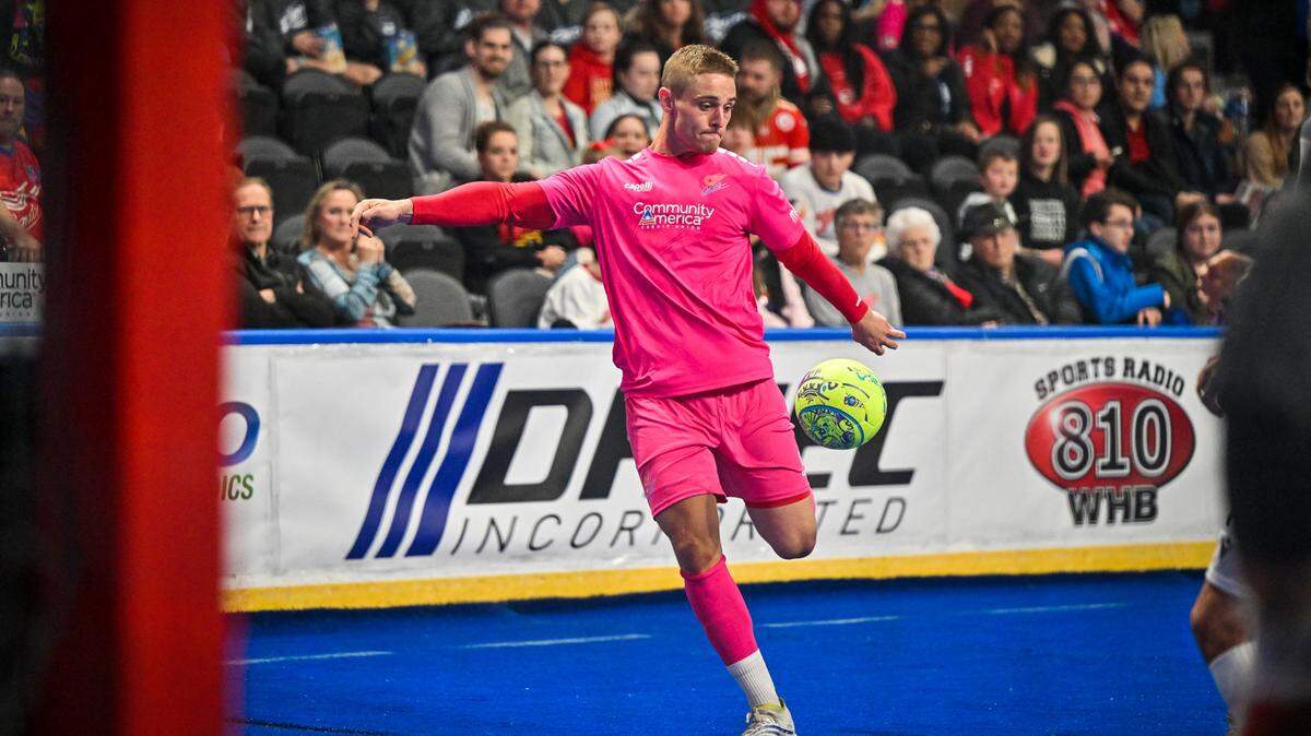 Comets player Zach Reget winds up for a shot during a 12-6 win against the Florida Tropics.