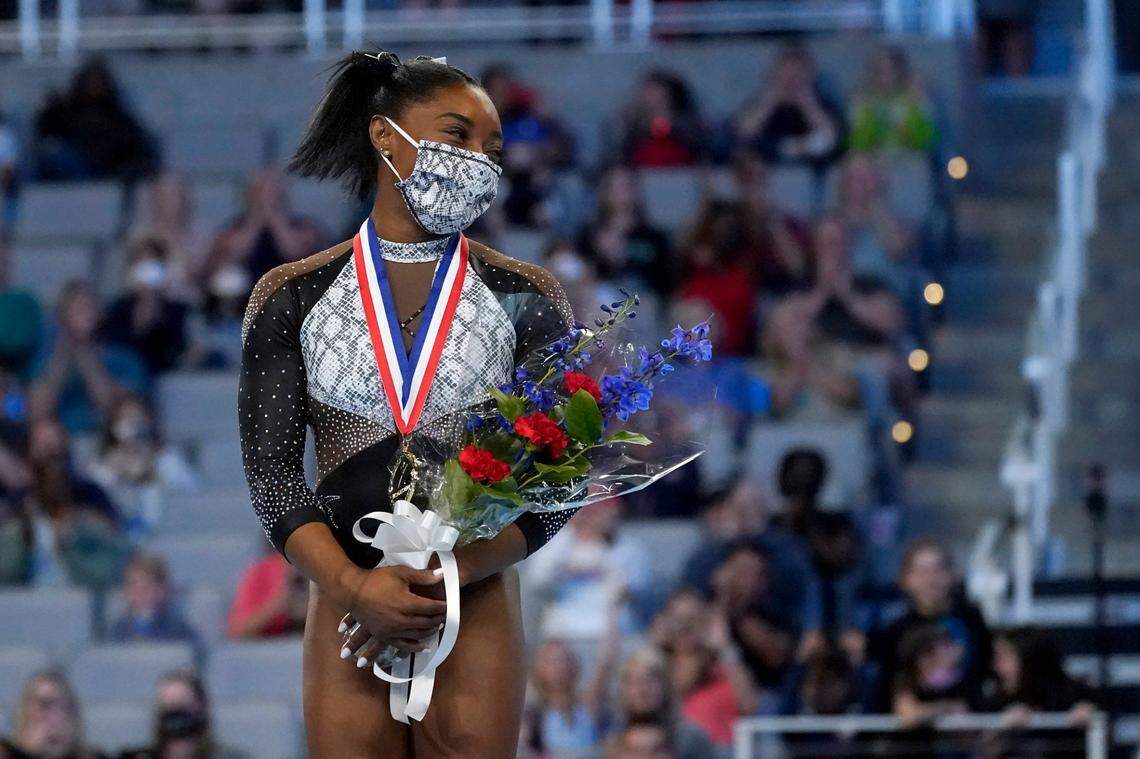 Simone Biles stands on the podium after earning first place in the all-around following the U.S. Gymnastics Championships, Sunday, June 6, 2021, in Fort Worth, Texas.