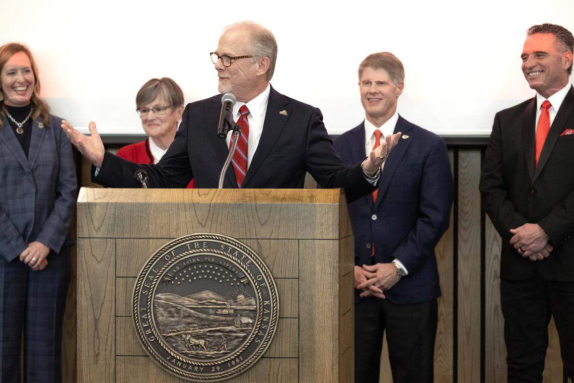 Olathe Mayor John Bacon speaks to the audience following Kansas Governor Laura Kelly's announcement in Topeka on Monday, Dec. 22, 2025, that the Kansas City Chiefs will construct their new stadium in Kansas City, Kansas, with a practice facility planned for Olathe