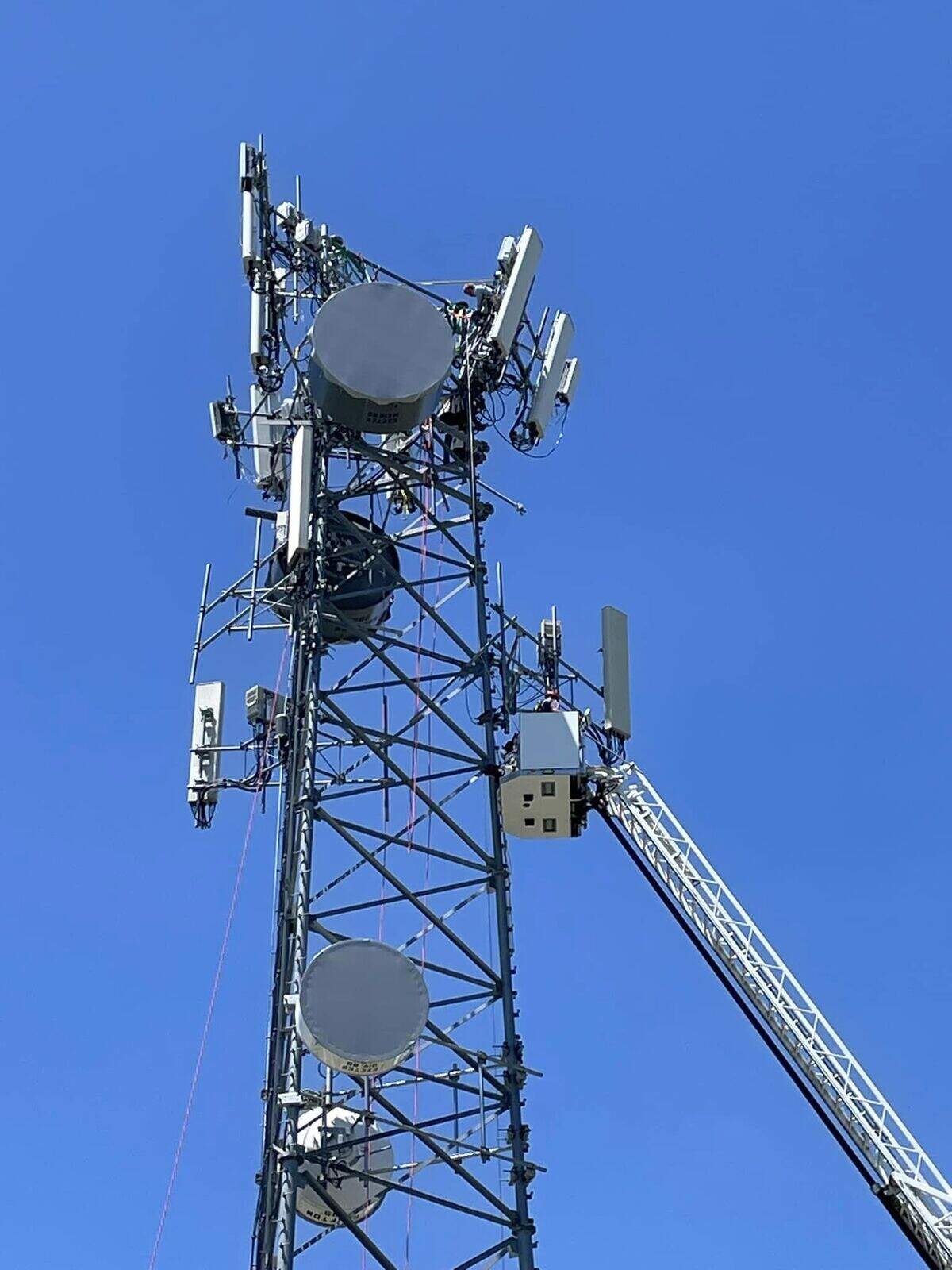A man trapped under steel at the top of a cellphone tower was rescued on June 11, Nebraska fire officials said.