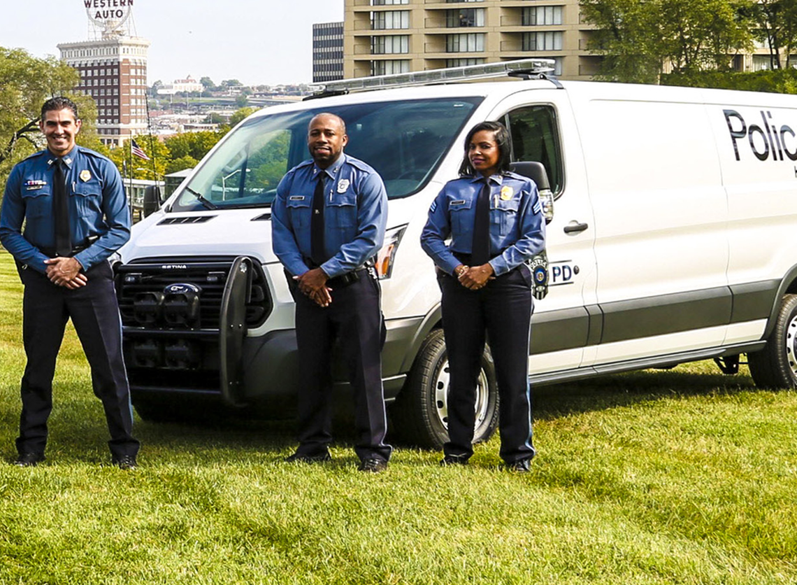 Former officer Kevin Sorrells (center) appeared on the cover of the Kansas City Police Department’s annual report in 2017. Sorrells, who worked for KCPD from 2012 to 2018, said he left the department after facing discrimination and now works as a supervisor at the Ford auto plant in Claycomo.