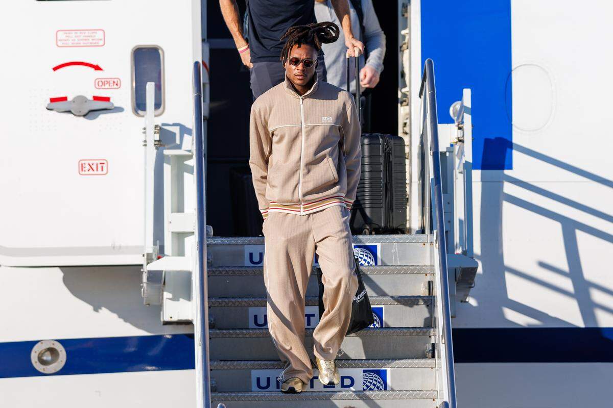 Kansas City Chiefs wide receiver DeAndre Hopkins (8) exits the plane after arriving at Louis Armstrong New Orleans International Airport on Feb. 2, 2025.