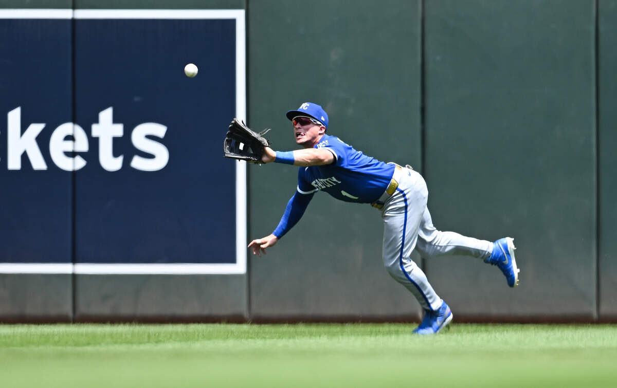 Isaac Collins #1 of the Kansas City Royals makes a diving catch for an out against the Minnesota Twins during the first inning of the game at Target Field on June 7, 2026 in Minneapolis, Minnesota.