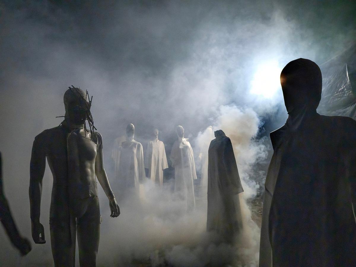 Shadowy figures are shrouded in mist along the trail at Exiled KC-Crooked Rose Woods.