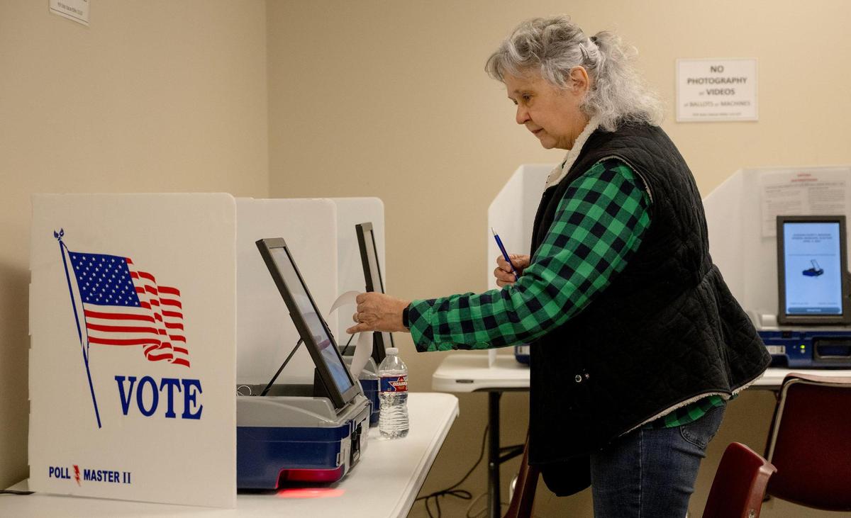 Becky Wells of Grain Valley, Missouri, votes in a general municipal election on Friday, March 29, 2024, in Independence.