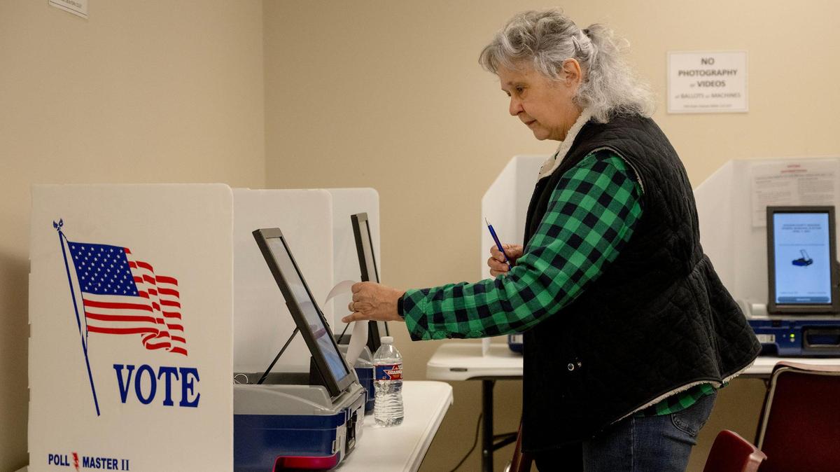 Becky Wells of Grain Valley, Missouri, votes in a general municipal election on Friday, March 29, 2024, in Independence.