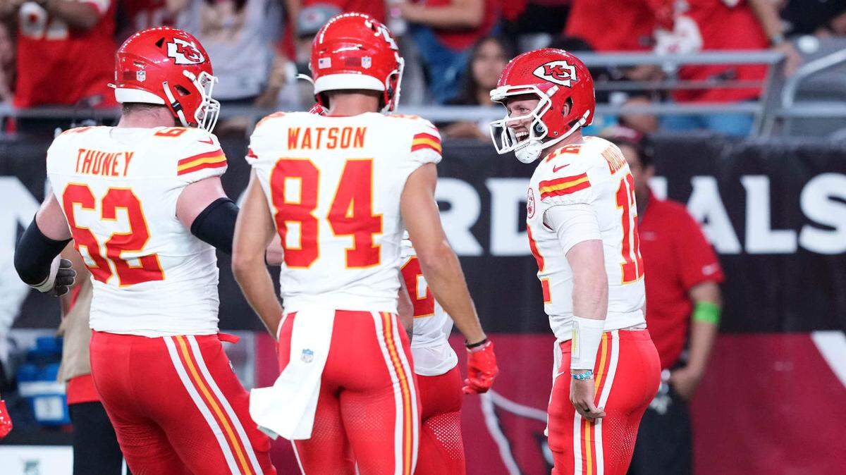 Kansas City Chiefs quarterback Shane Buechele (12) celebrates a touchdown against the Arizona Cardinals during the first half of a preseason game at State Farm Stadium on Aug. 19, 2023.