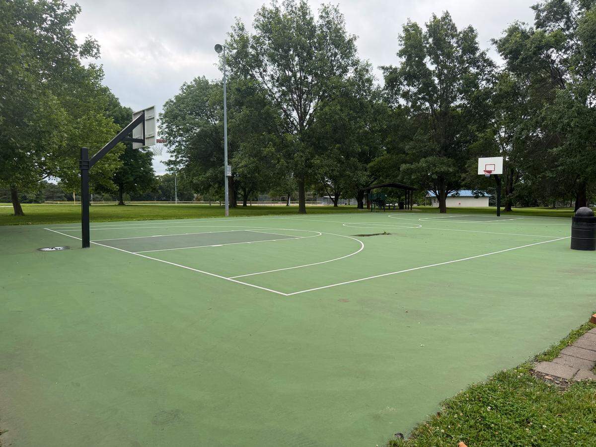 There are various cracks and damage to the basketball courts at Black Bob Park in Olathe. 