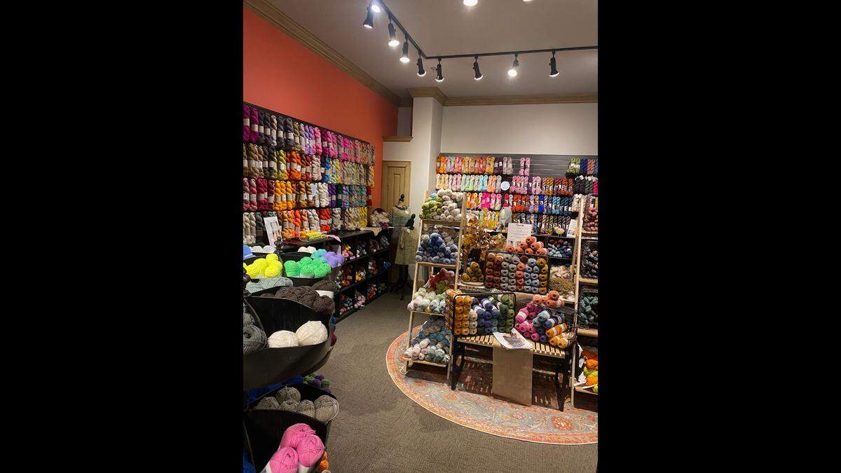 Tammy Garrison’s shot, Unwind Fiber Arts, specializes in hand-dyed and luxury yarns. Most are produced by women-owned businesses.