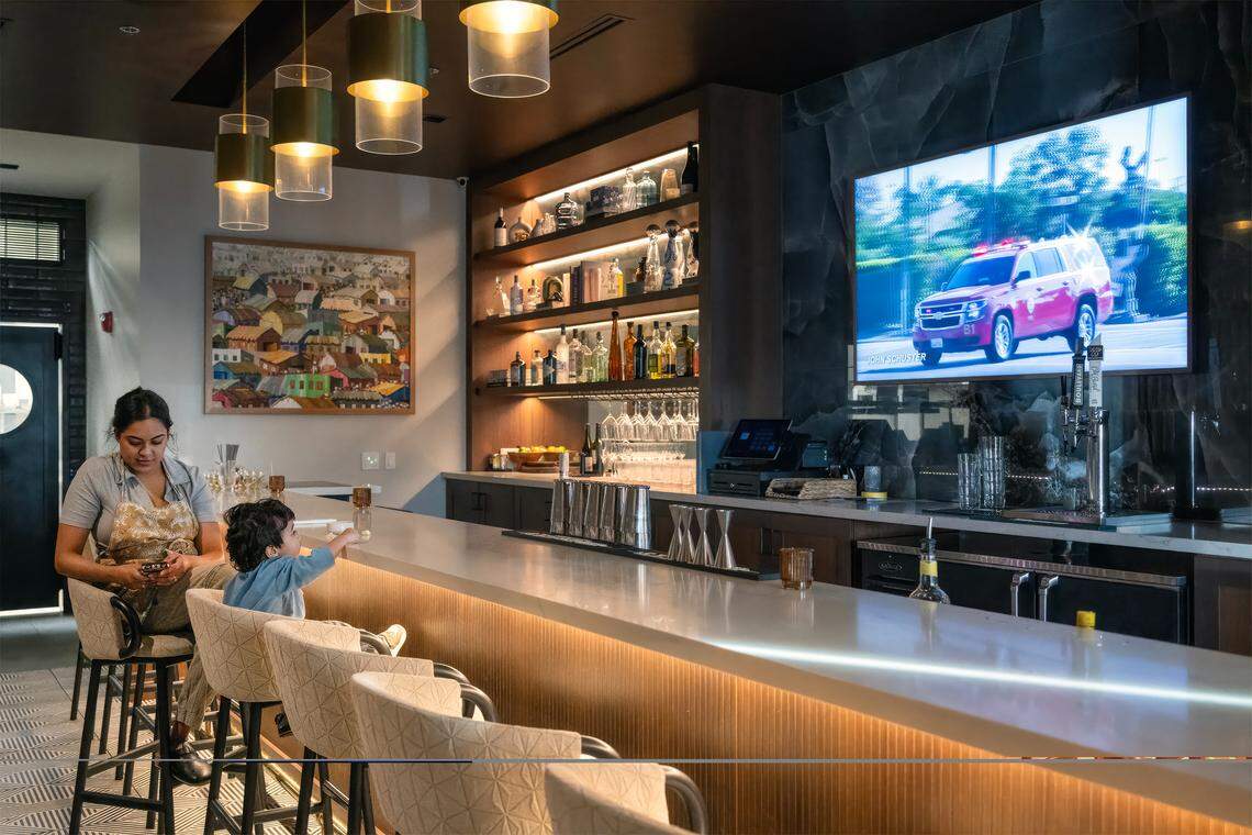 “Just raising a child is what it feels like,” said chef/owner Swetha Newcomb, of Of Course Kitchen & Co., as she sat with her 20‑month‑old son, Zev, at the restaurant’s bar in Overland Park on Wednesday, Feb. 25, 2026. “I would say that owning a restaurant is harder for me than being a mom.” Newcomb, 31, is a James Beard Best Chef: Midwest nominee.