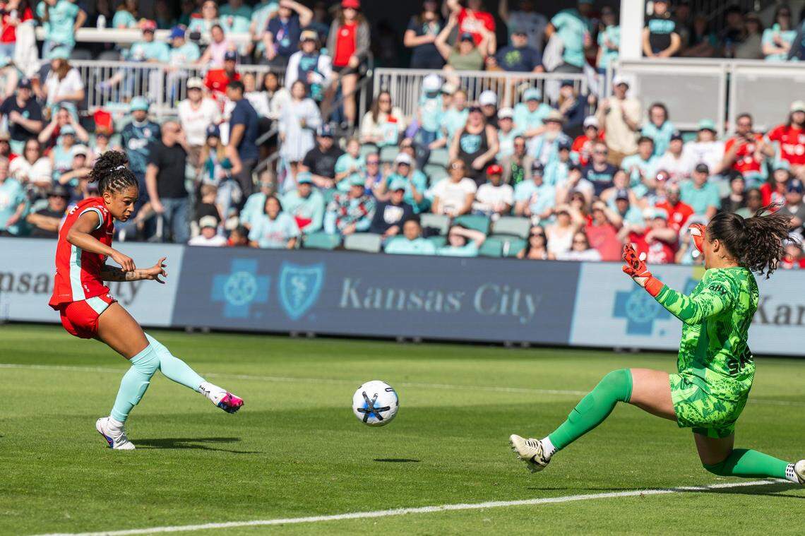Kansas City Current midfielder Croix Bethune (8) kicks the ball past the Utah Royals goalie to score a goal in the second half of the Current's match vs. the Utah Royals, on Saturday, March 14, 2026, at the CPKC Stadium. The Current won 2-1 against the Utah Royals.